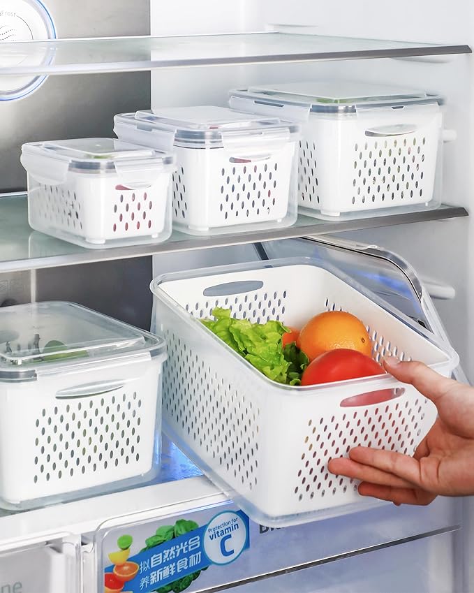 Fridge with storage baskets containing fruits and vegetables, with a hand reaching in.