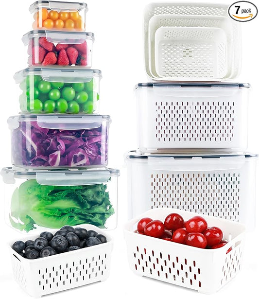 Set of white storage containers with lids containing various fruits and vegetables.